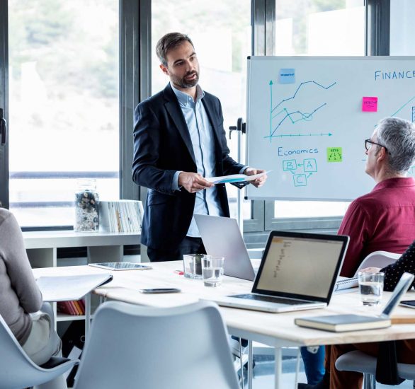 handsome-businessman-explaining-a-project-to-his-c-WKHERF9 handsome-businessman-explaining-a-project-to-his-c-WKHERF9