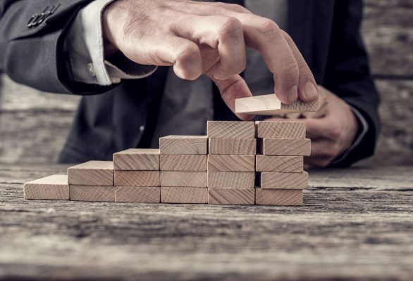 businessman-building-a-graph-or-ladder-of-success-P9NNLG6 businessman-building-a-graph-or-ladder-of-success-P9NNLG6